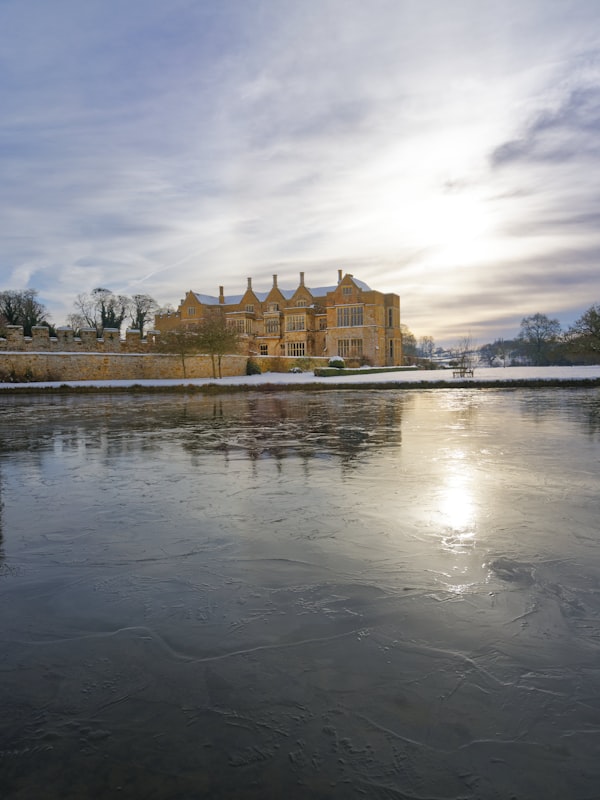 English manor house surrounded by grounds in the Cotswolds