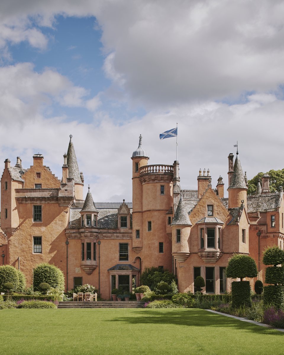 Turreted sandstone castle with formal lawns · Scottish Highlands