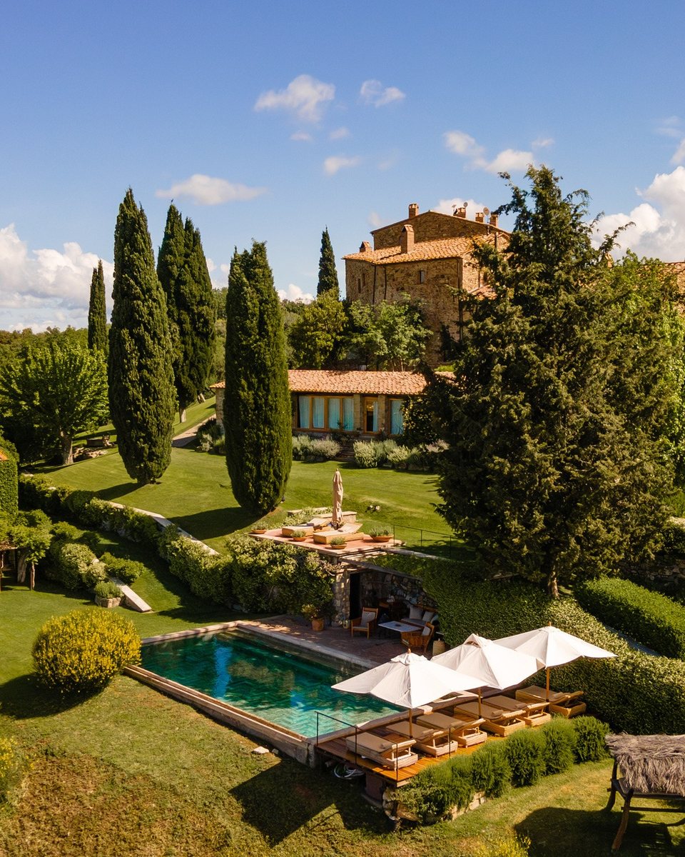 Hilltop Tuscan castle with cypress trees, gardens and pool · Tuscany, Italy
